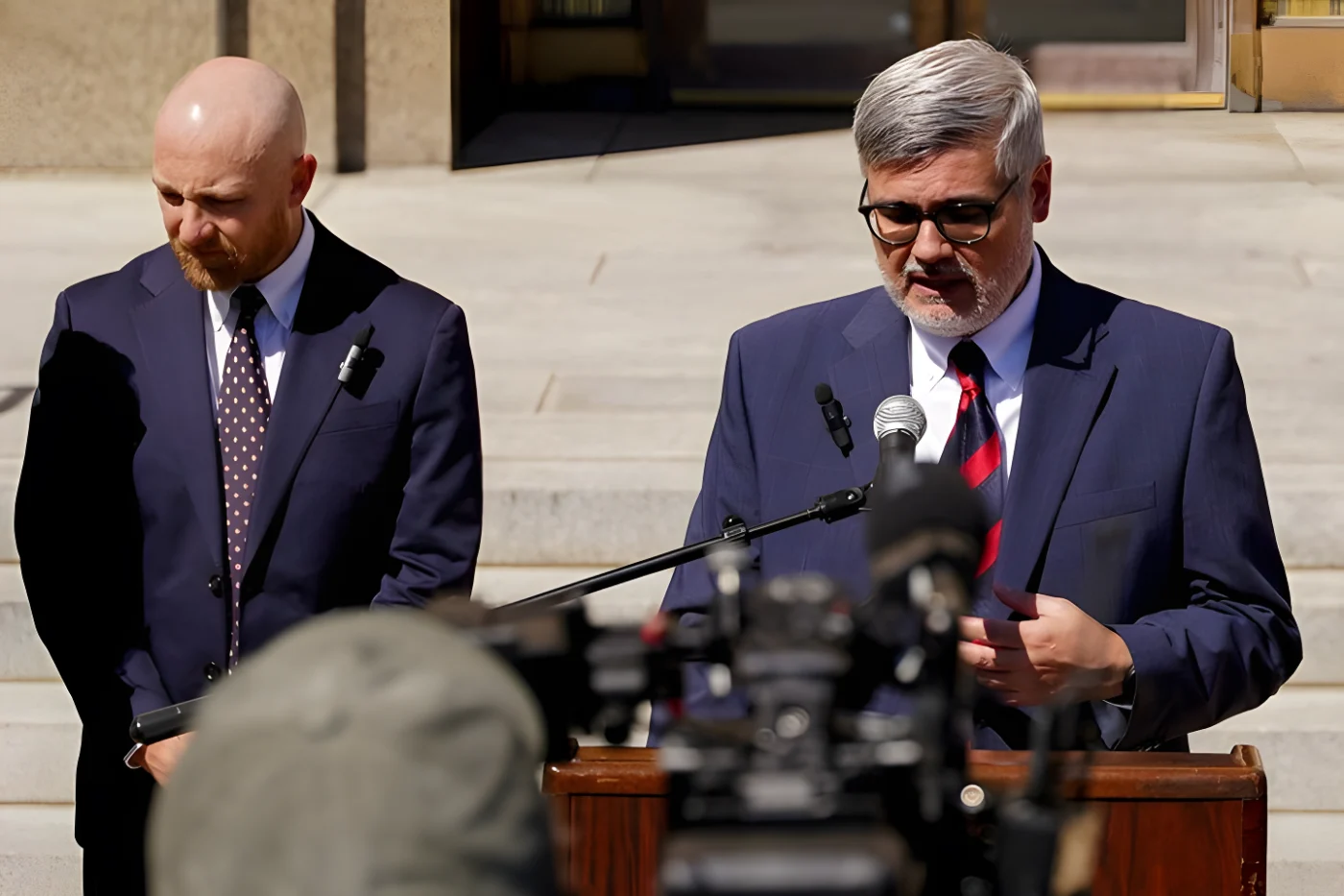 Randy Spivey, an attorney for Christa Pike, a death row prisoner who survived a botched execution, speaks to the media, flanked by Luke Ihnen, after a Tennessee court was presented a status update on Pike, outside a courtroom in Nashville, Tennessee, US, October 7, 2026. REUTERS/Seth Herald
